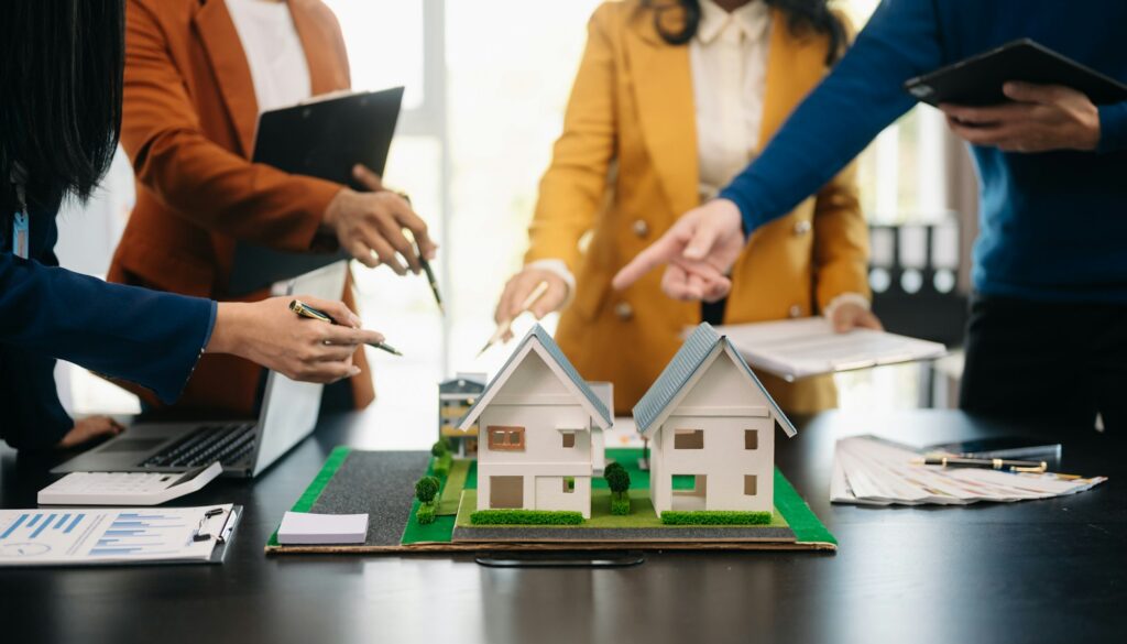 balancing the property sector The real estate agent is explaining the house style to see the house